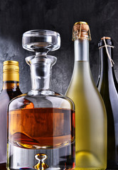 Carafe and bottles of assorted alcoholic beverages.