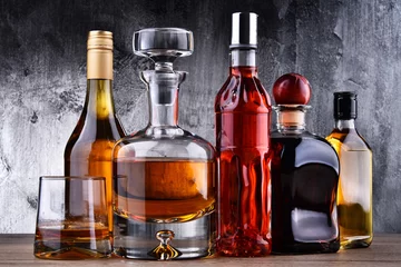Peel and stick wall murals Alcohol Carafe and bottles of assorted alcoholic beverages.