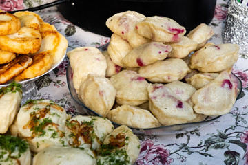 Traditional dumplings with fried onions at a street food festival