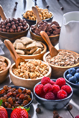 Different sorts of breakfast cereal products and fresh fruits