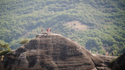 Tourists enjoying views from Meteora mountains in Greece