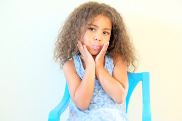 Cute girl sitting relaxing on chair at table