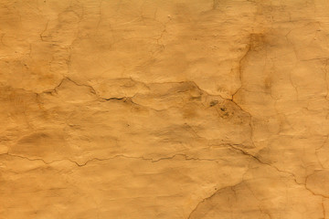  texture of old canvas of yellow color with cracks and scratches