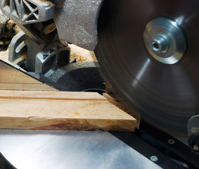 Carpenter tools on wooden table with sawdust. Circular Saw. Cutting a wooden plank