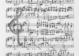 Treble clef on music sheet - musical background