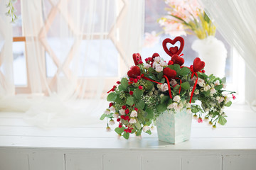 beautiful composition of spring flowers and red hearts. A gift for St. Valentine's day. Wedding concept