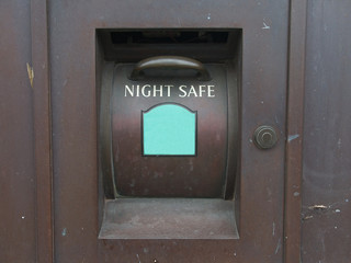 Close-up of a traditional Night Safe, a deposit slot on the outside of a bank allowing money to be deposited into the bank's safe outside of bank's opening hours.