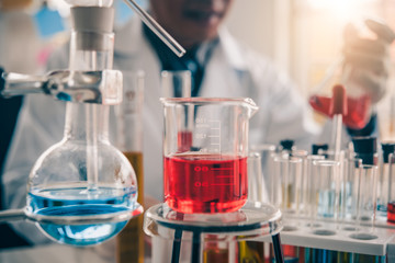 Test tube containing chemical liquid in laboratory, lab chemistry or science research and...