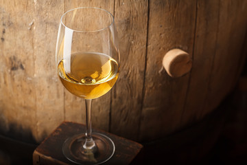 White wine near a barrel