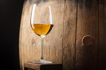 White wine near a barrel