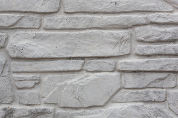 Abstract background. Wall made of brick, covered with paint.