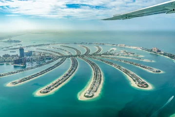 Tuinposter Aerial view of Dubai Palm Jumeirah island, United Arab Emirates © Delphotostock