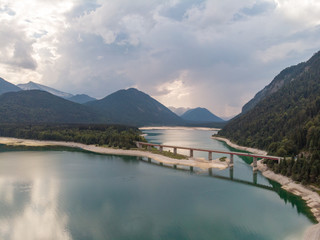 Amazing bridge over accumulation lake Sylvenstein, upper Bavaria. Aerial view. September, 2018