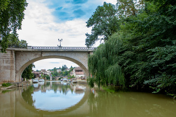 Fototapeta premium Nerac France 10-17-2018. Old houses and bridge in the city of Nerac in France.