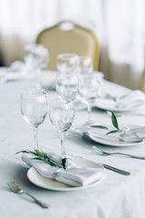 Decor wedding table in the cafe. Floristry and glass glasses at the wedding.