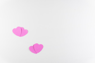 Obraz na płótnie Canvas Hand-made pink love hearts isolated on white wooden texture background, Happy valentine's day. holiday background, Flat lay, top view, copy space