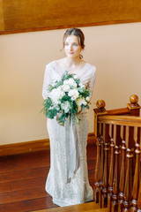 Bride fees at the hotel in the European style. Boudoir photo shoot and wedding dress.