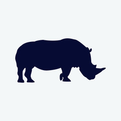 Vector silhouette of a rhinoceros on a white background.