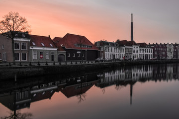 Fototapeta premium Sunset over the canal houses in Bergen op Zoom, the Netherlands
