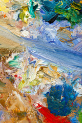 Fototapeta na wymiar Vibrant multi-coloured artists oil or acrylic paints palette semi abstract close-up