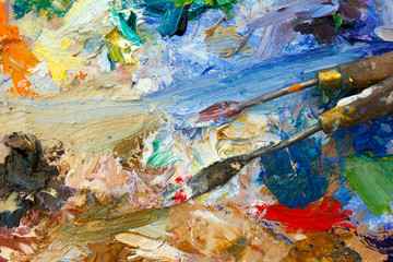 Vibrant multi-coloured artists oil or acrylic paints palette semi abstract close-up with palette knives