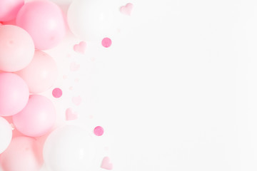 Balloons on white background. Frame made of white and pink balloons. Birthday, valentines day, holiday concept. Flat lay, top view, copy space