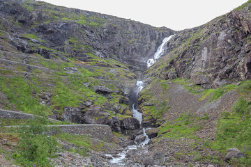 Looking up at the Stigfossen with the Trollstigen in the foreground