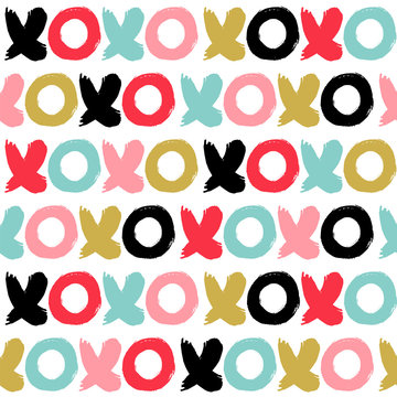 Seamless vector pattern with xoxo in a cute colors.