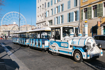 Petit Train, Marseille, France. Reach Notre-Dame-de-la-Garde passing along the costal road and enjoying, in the background, the If castle and the Frioul islands.