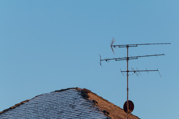 old TV antennas on the roof