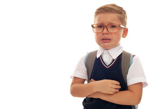 Portrait Of Tired Ans Sad School Boy With Eyeglasses And Backpack