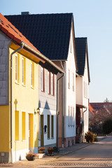 Fototapeta na wymiar colored house fronts in the sunlight