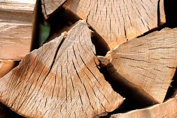 A pile of stacked firewood, prepared for heating the house. Gathering fire wood for winter or...