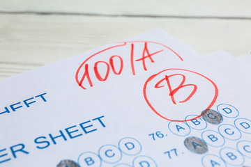 Checked answer sheets, closeup. Concept of passing exam