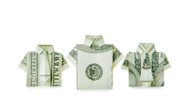 Origami shirts made of dollar banknotes on white background