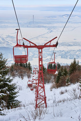 Empty old wooden chairlifts near Brasov city, Romania.