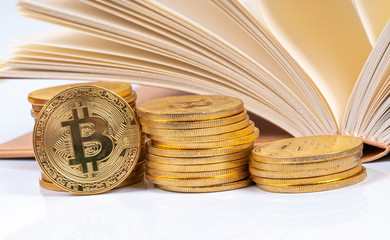 Book and cryto coins with education concept