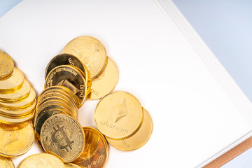 Book and cryto coins with education concept