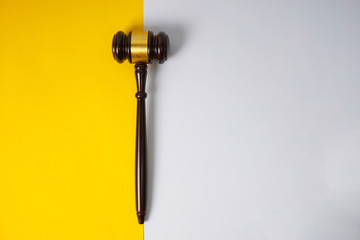 Gavel hammer with yellow background