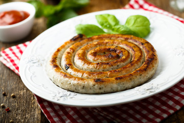 Grilled sausage with tomato sauce