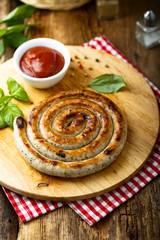 Grilled sausage with tomato sauce