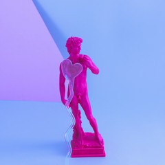 Creative concept of purple neon David, the a masterpiece of Renaissance sculpture created  by...