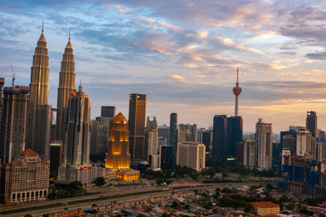 kUALA LUMPUR, MALAYSIA - AUGUST 31, 2018: Building at center of metropolis during sunset view.