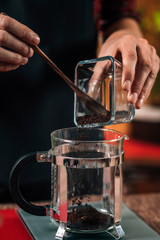 Fototapeta na wymiar Weighing Coffee. Barista Weighs Ground Coffee On a Scale