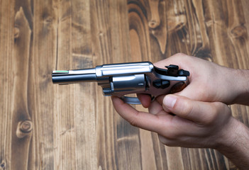 gun in mans hand