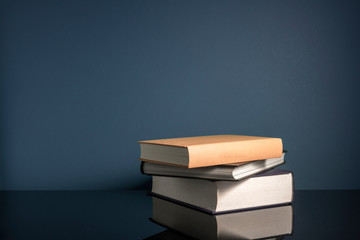 Stalking books and clock with low light