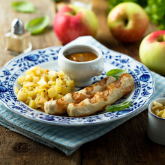 Grilled sausages with potato apple salad