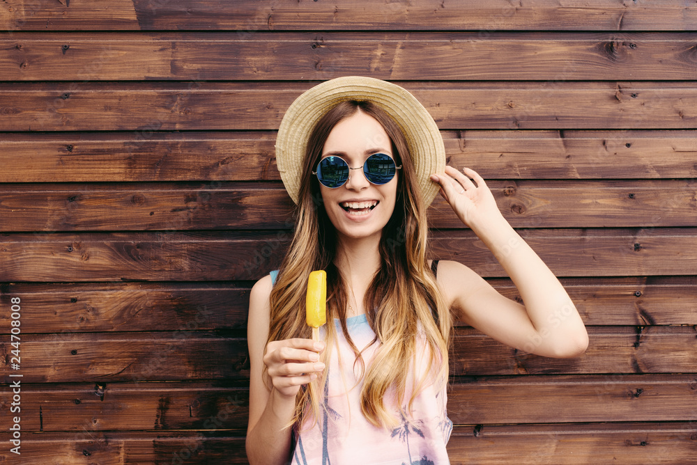 Wall mural Cool hipster student woman wearing eyewear glasses . Caucasian female university student looking at camera smiling happy