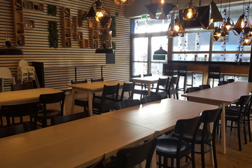 Cozy wooden interior of a modern urban restaurant
