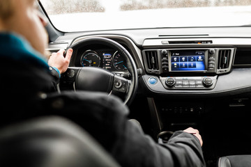 Close-up of Young man driving on the road.